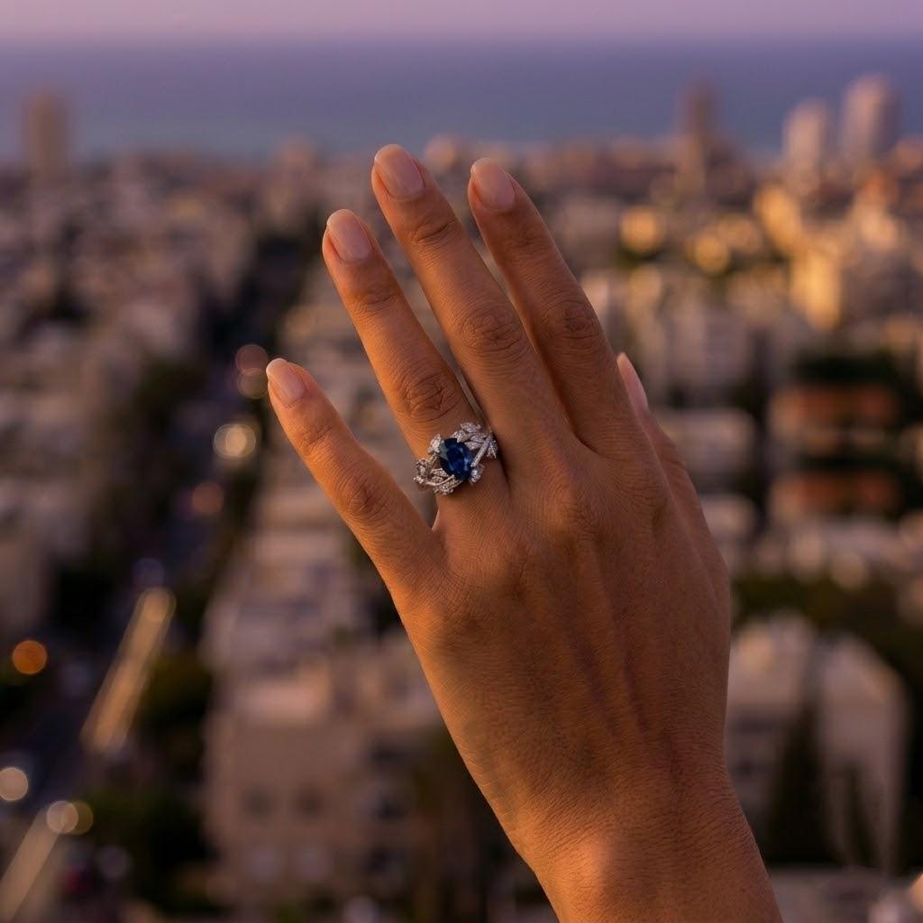 טבעת לוטם - טבעת ענפים עם אבן ספיר אובלית ויהלומי מרקיזה