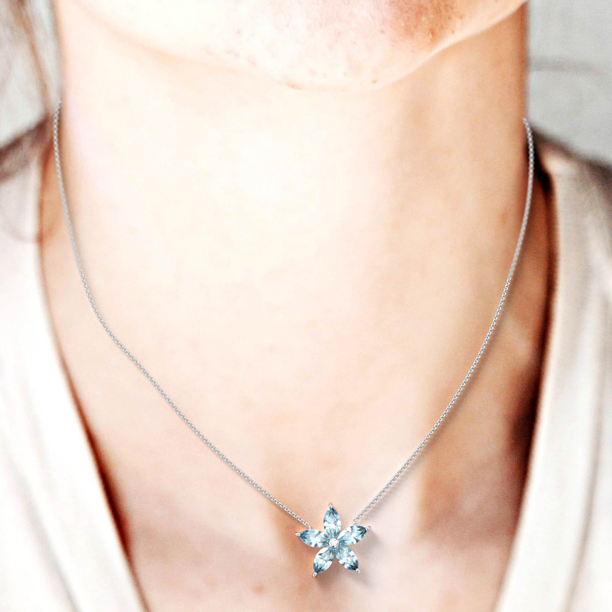 Blossom necklace - gold necklace with an aquamarine flower pendant and a diamond