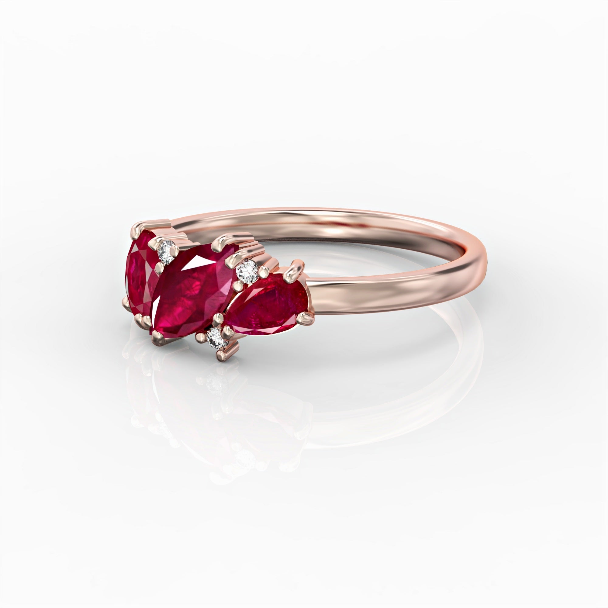 Kan ring - a cluster ring set with marquise, oval, drop and diamond rubies