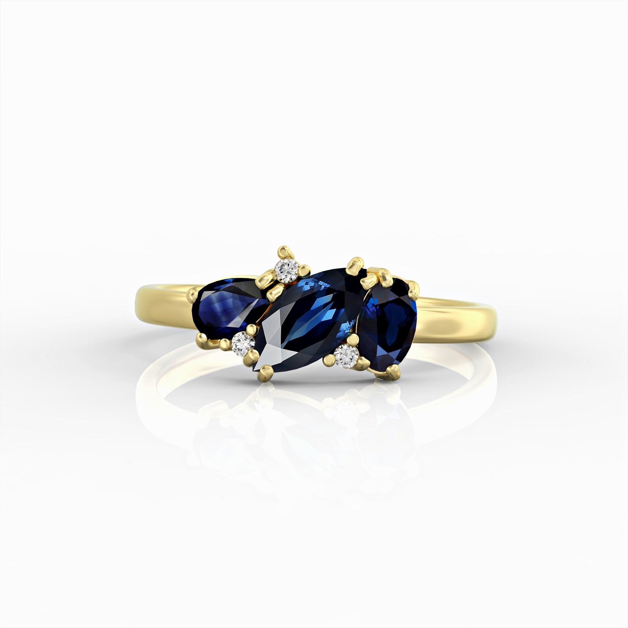 Kan ring - a cluster ring set with a marquise sapphire, an oval, a drop and diamonds