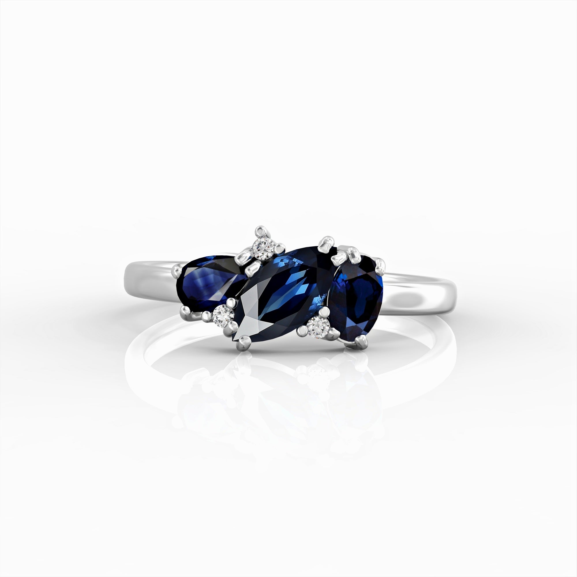 Kan ring - a cluster ring set with a marquise sapphire, an oval, a drop and diamonds