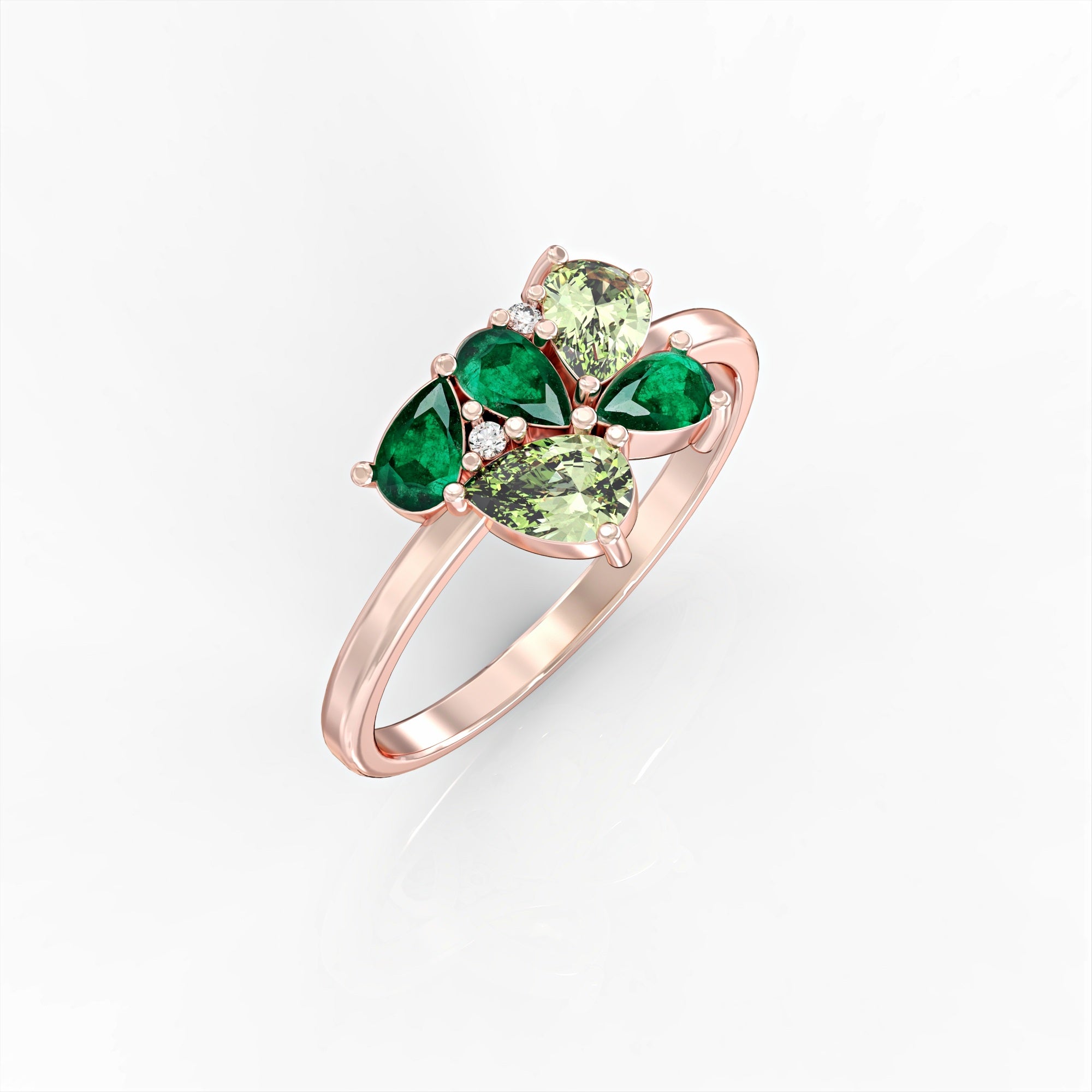 Scholarship ring - a cluster ring set with an emerald and a drop peridot and diamonds 