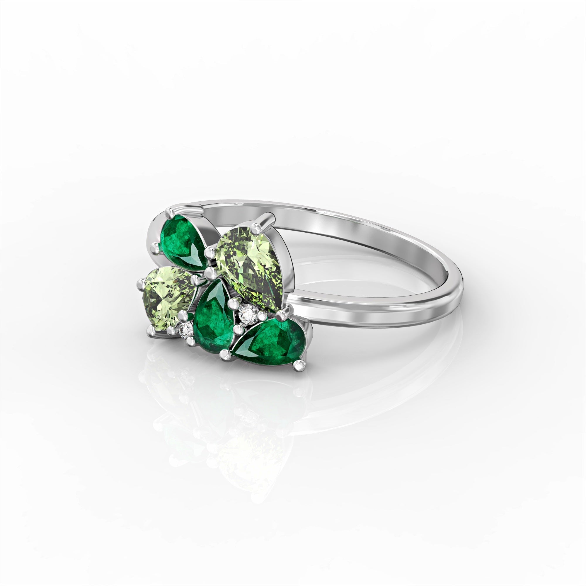 Scholarship ring - a cluster ring set with an emerald and a drop peridot and diamonds 