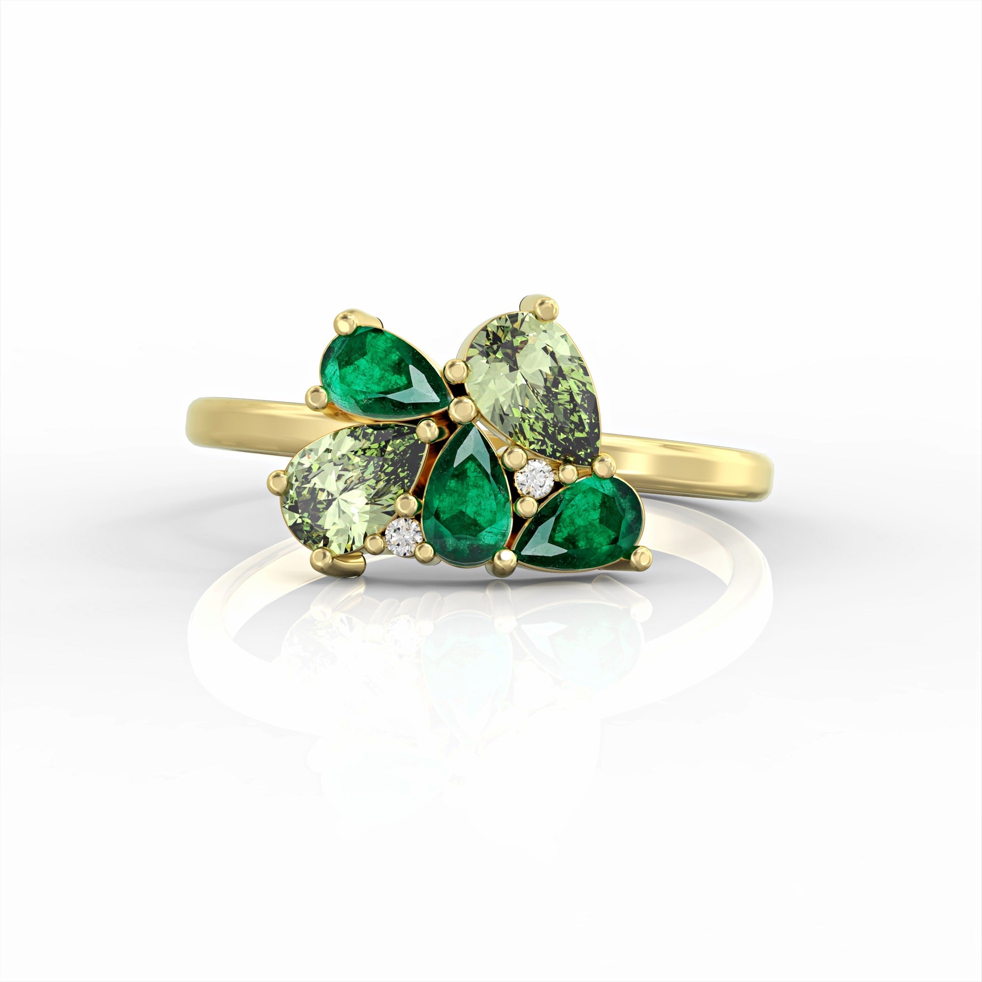 Scholarship ring - a cluster ring set with an emerald and a drop peridot and diamonds 