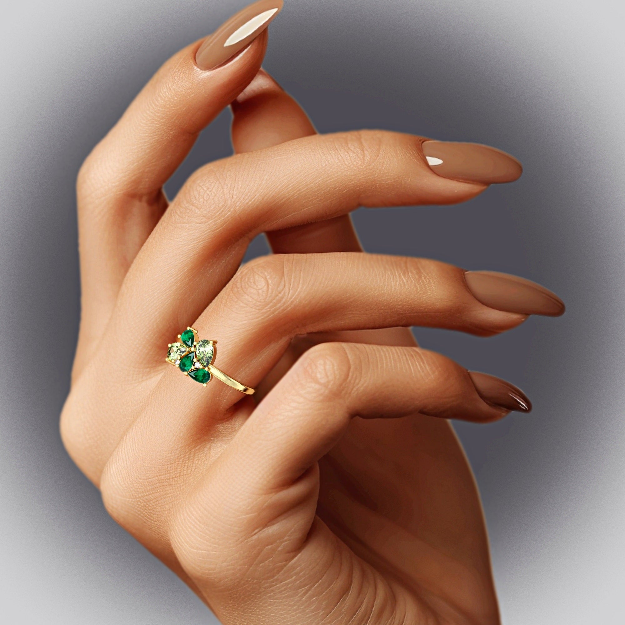 Scholarship ring - a cluster ring set with an emerald and a drop peridot and diamonds 