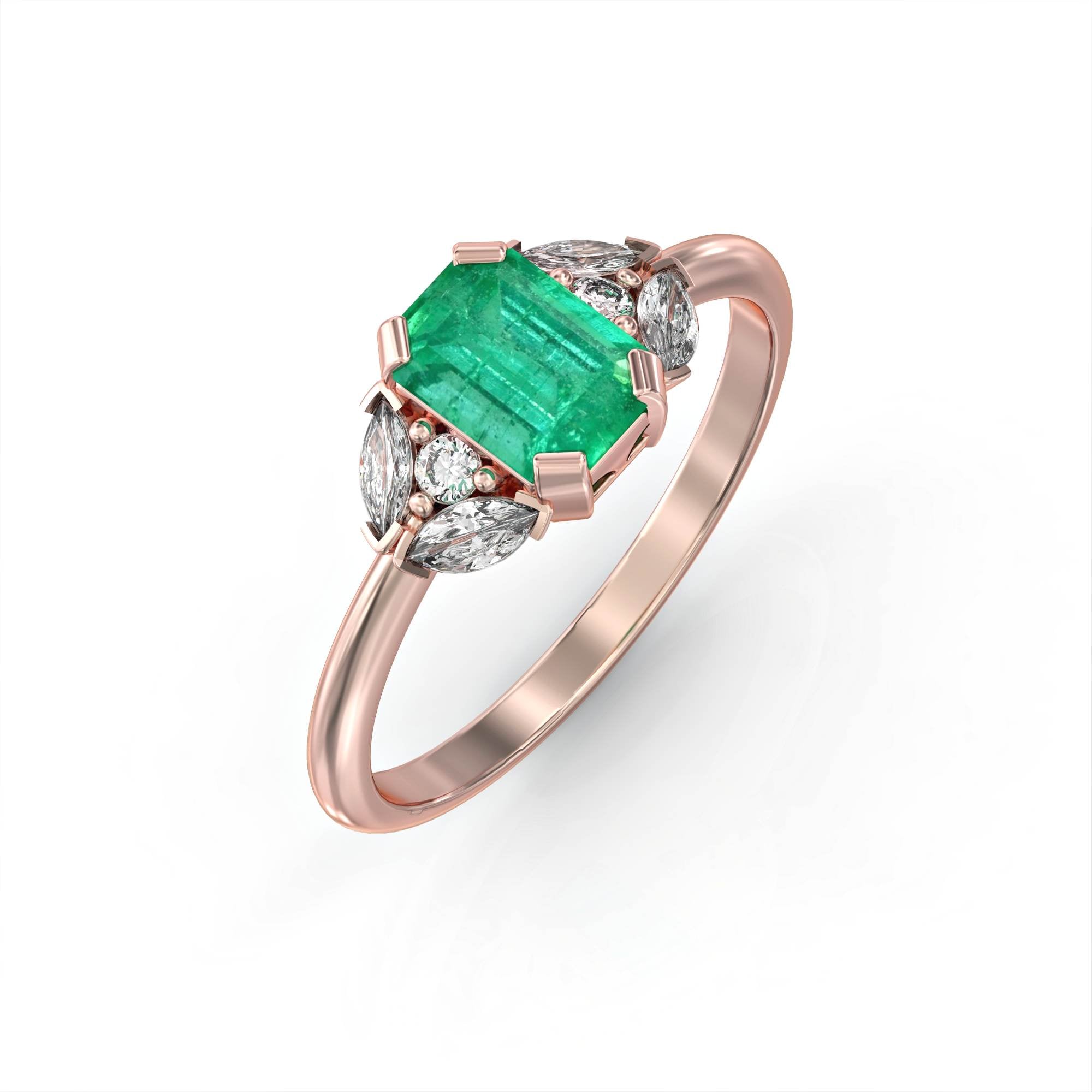 Capri - an engagement ring set with emeralds and diamonds