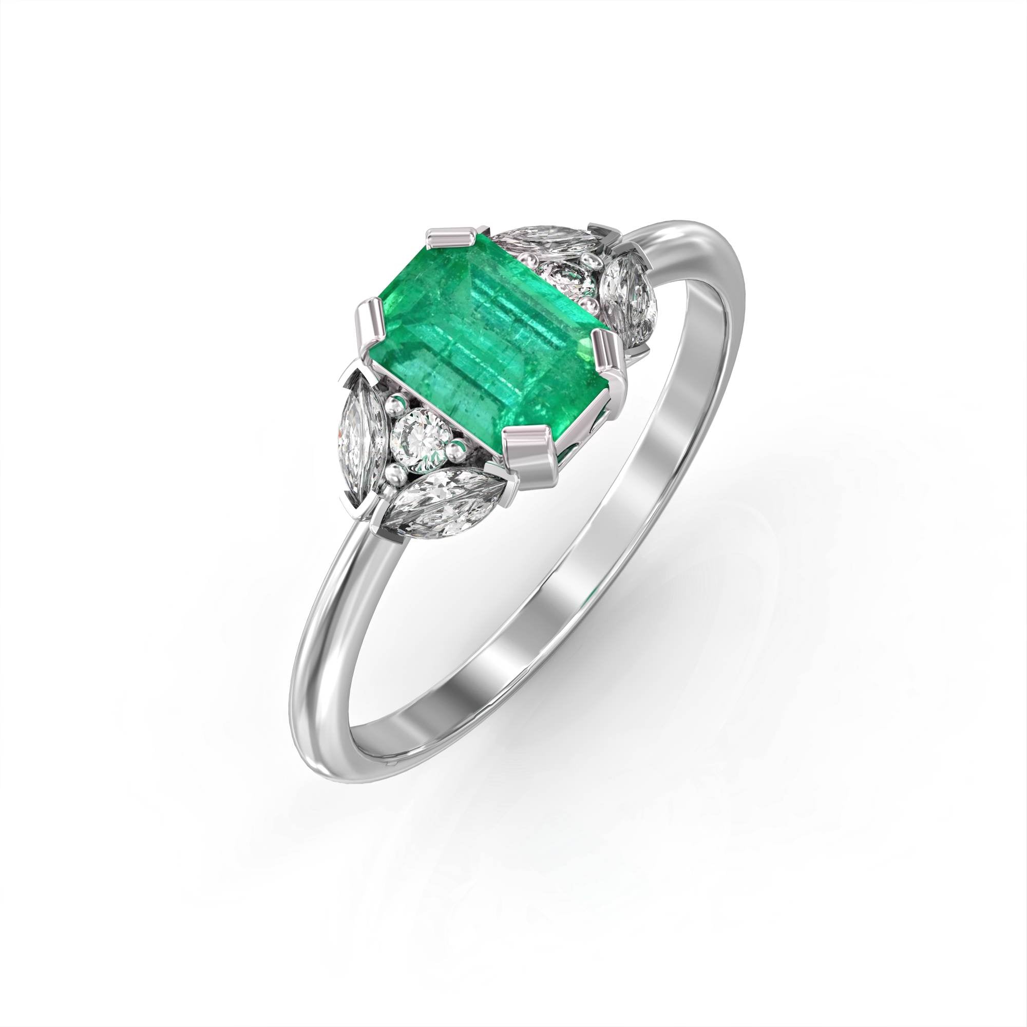 Capri - an engagement ring set with emeralds and diamonds