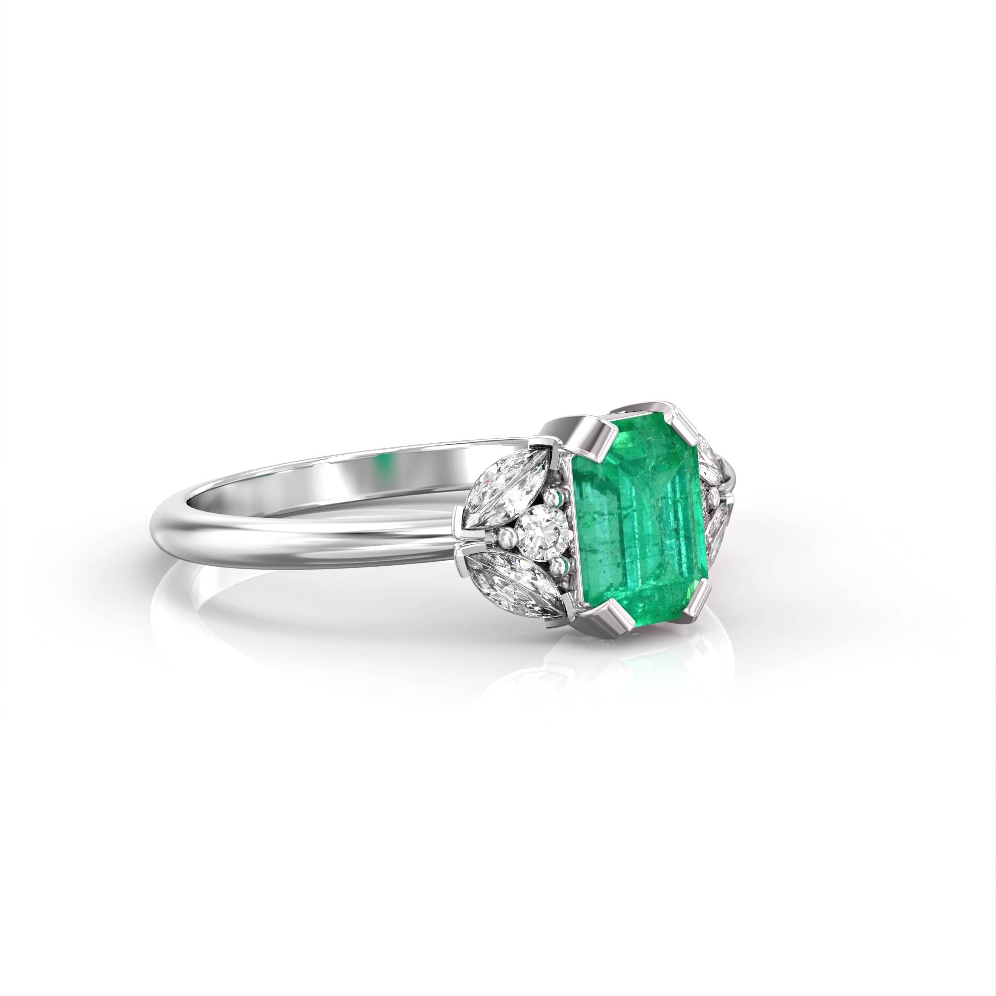 Capri - an engagement ring set with emeralds and diamonds