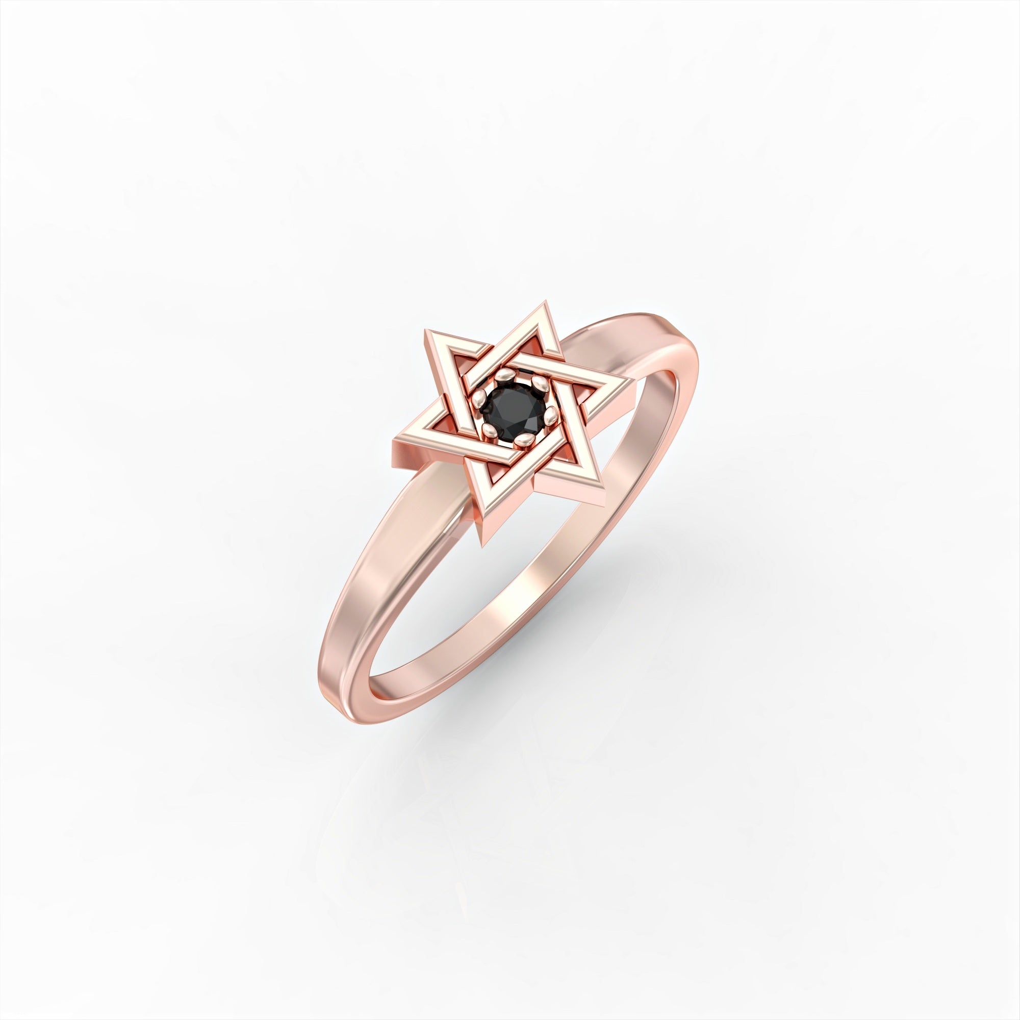 A Star of David ring set with a black diamond 